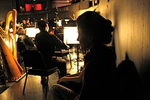 Two dancers listening to the orchestra pit